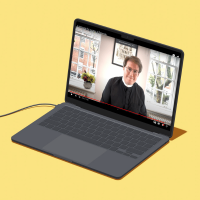 The Revd Ben Cahill-Nicholls, in a screenshot of a video, being played on a cartoon laptop.