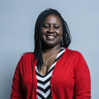 Marsha de Cordova, wearing a red cardigan and a striped top.