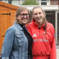 Sarah, wearing her clerical collar, and her daughter, Maddie, in her Team GB uniform.